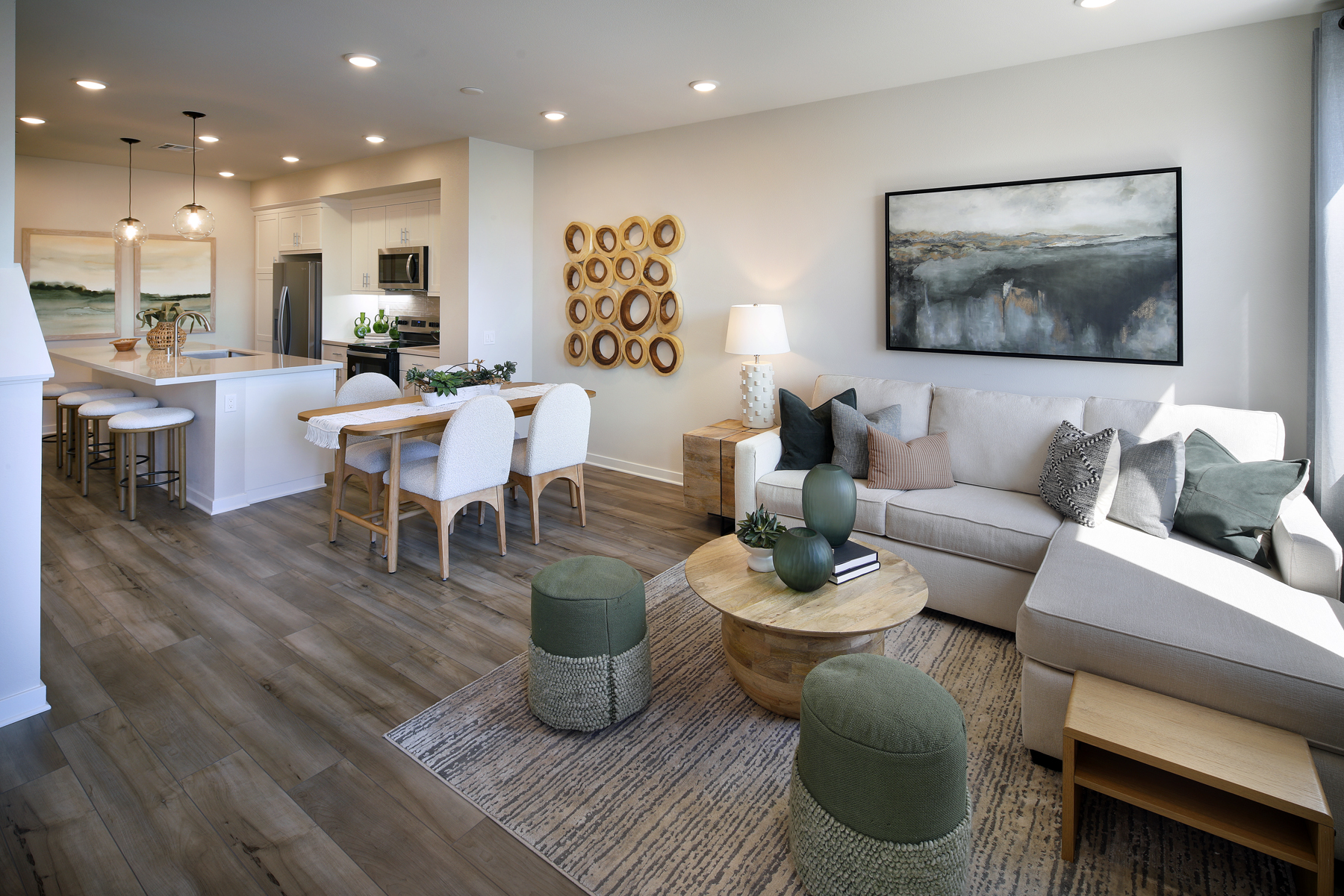 A living room with a large dining table and couches.
