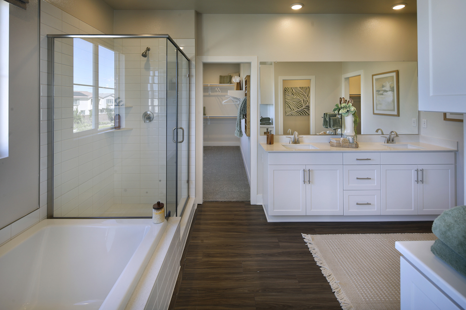 A bathroom with a tub and sink.