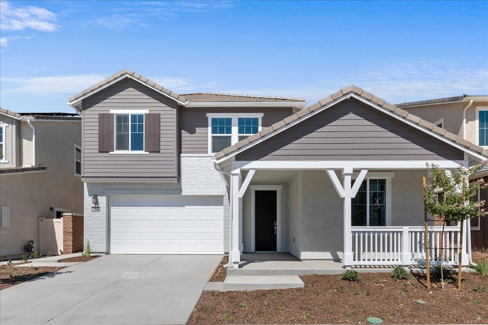 A house with a white fence.