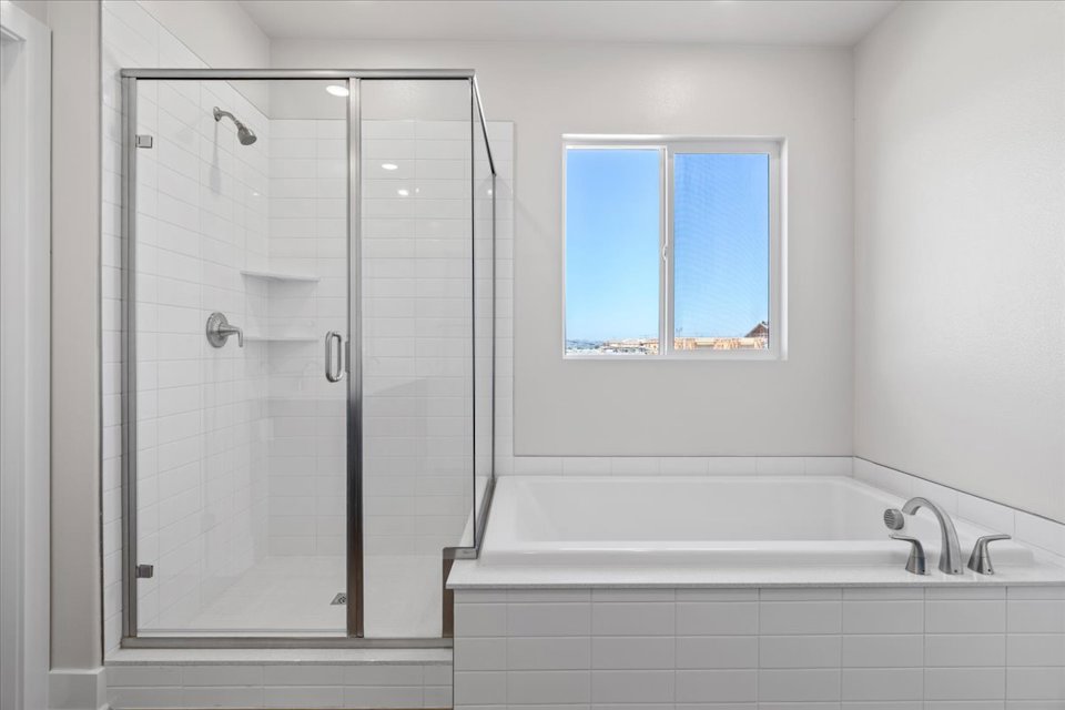 A bathroom with a glass shower.