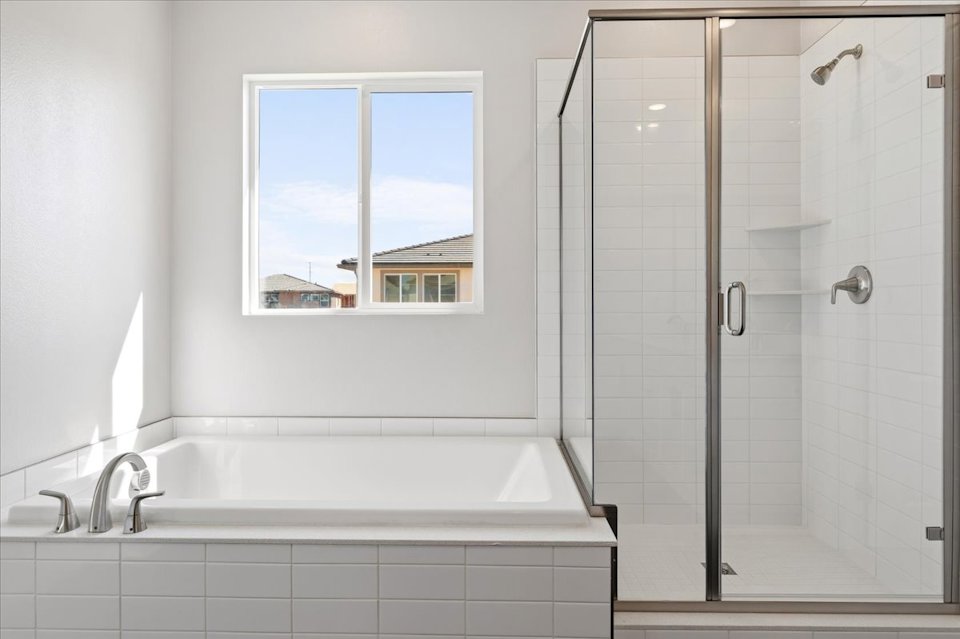 A bathroom with a glass shower.