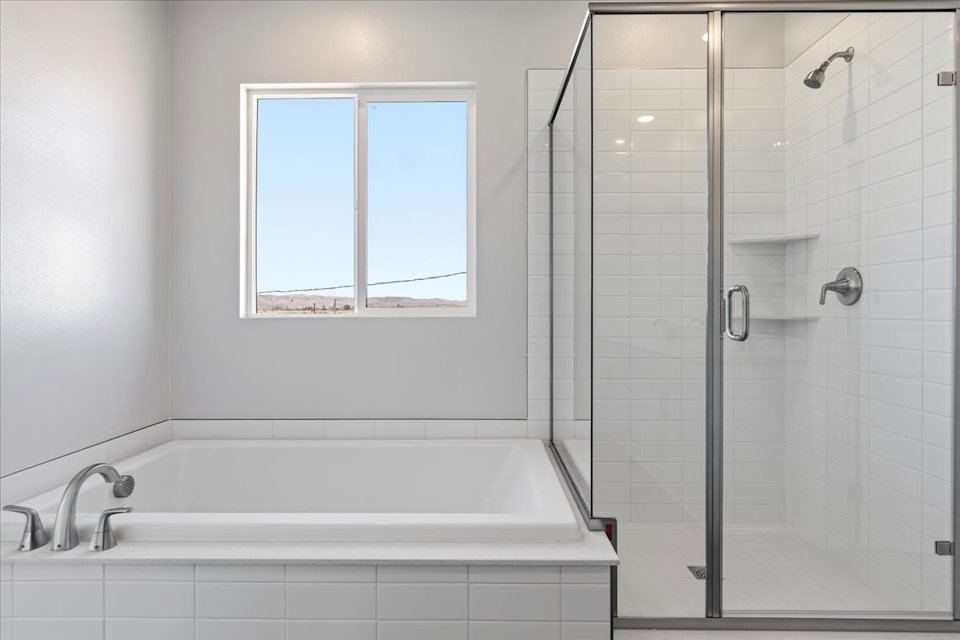 A bathroom with a glass shower.