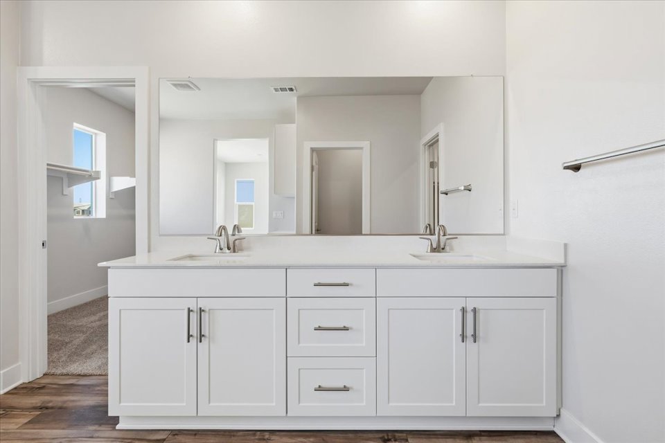 A white kitchen with white cabinets.