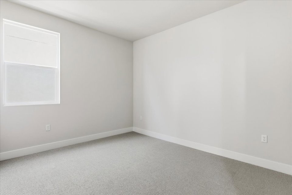 A white room with a white wall.