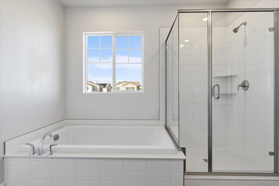 A bathroom with a glass shower.