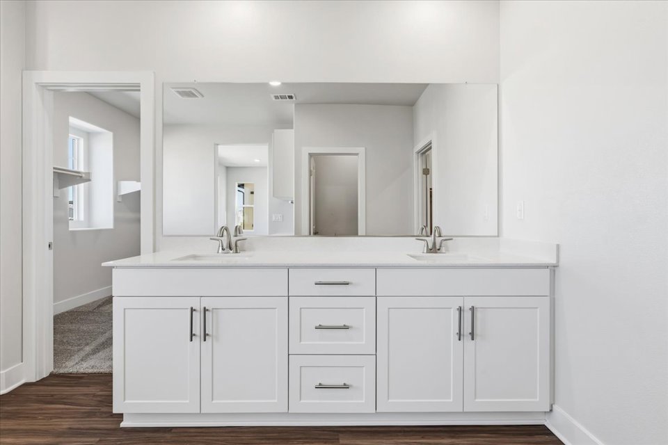A white kitchen with white cabinets.