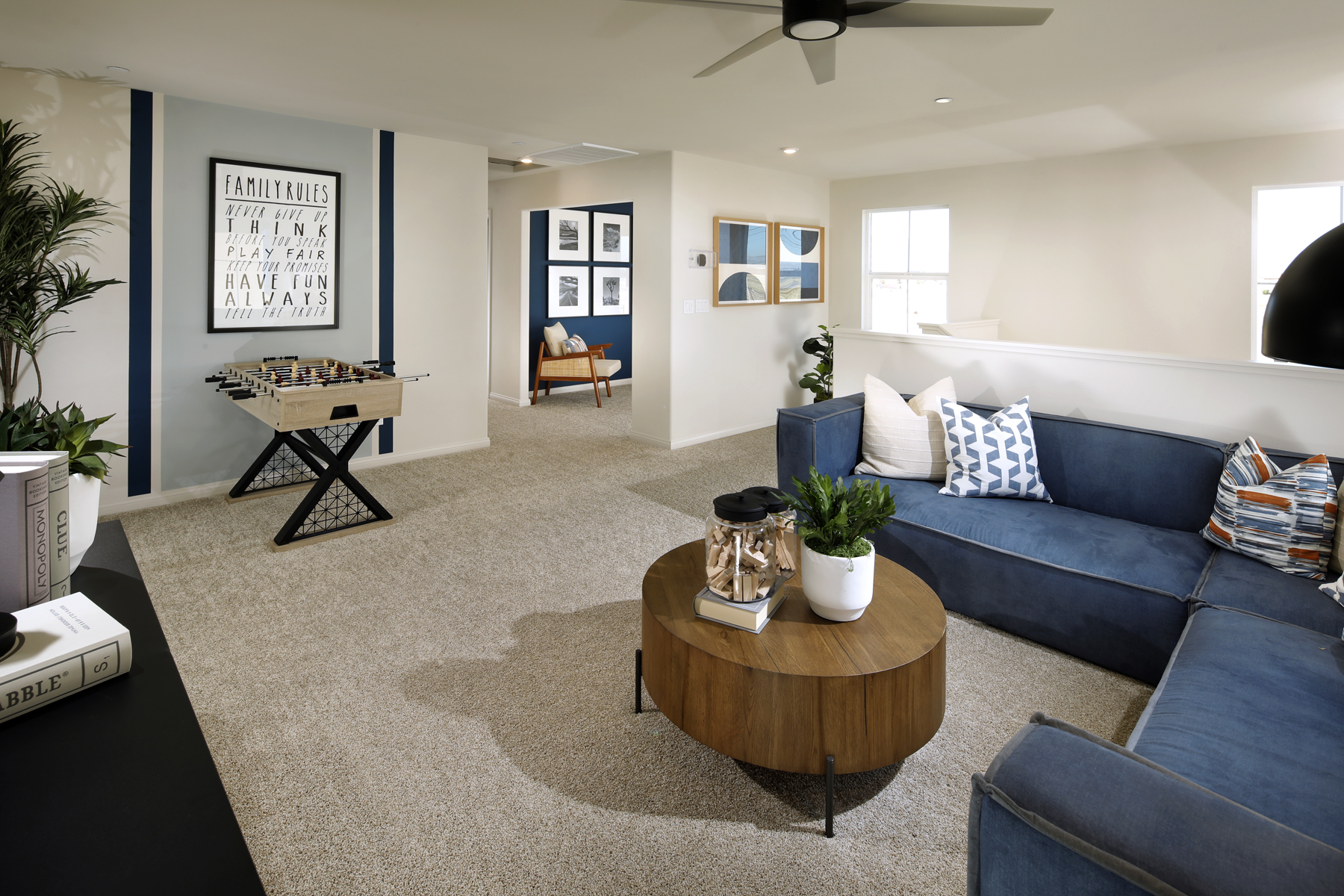 A living room with blue couches.