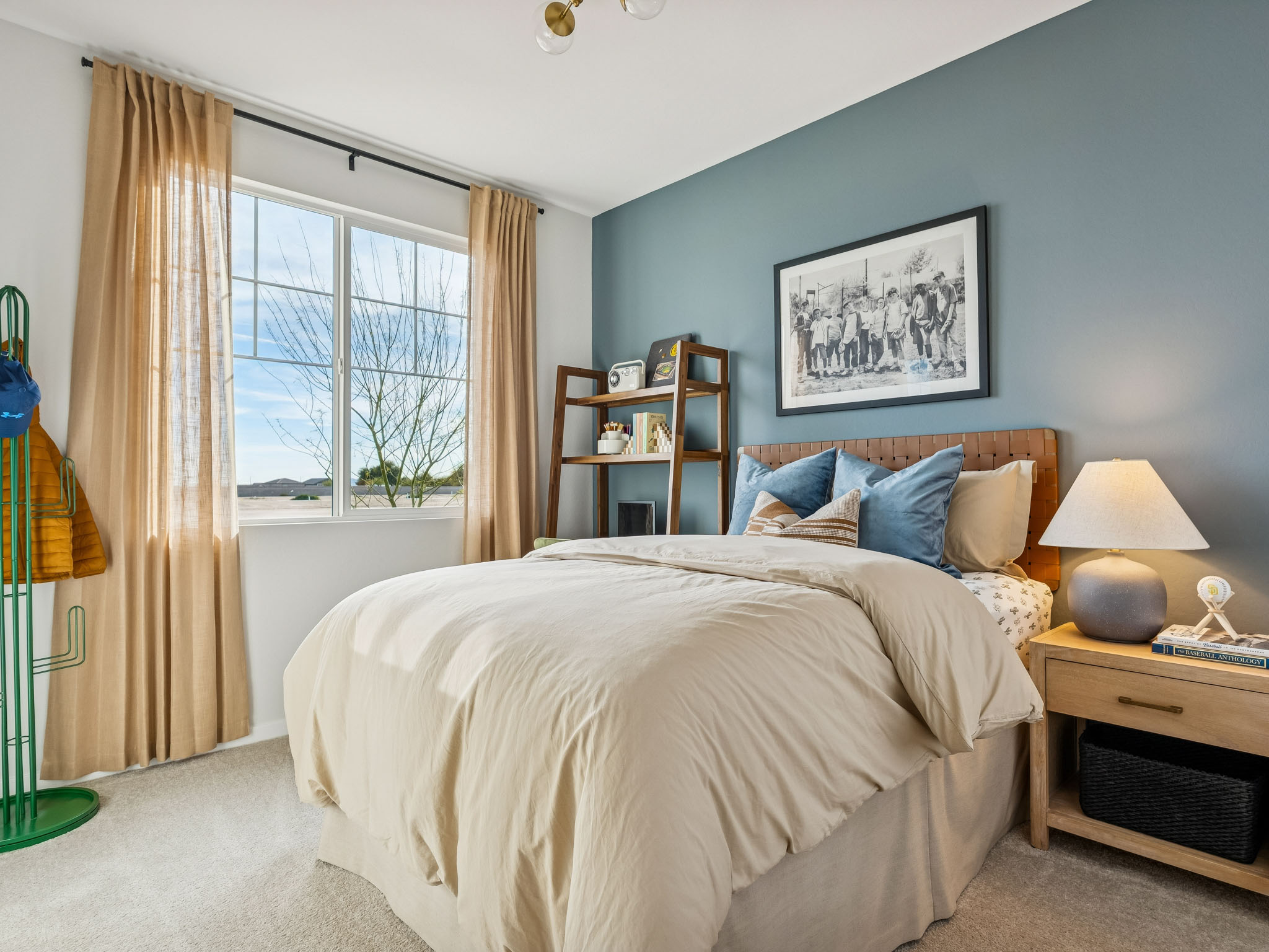 A bedroom with a bed and a window.