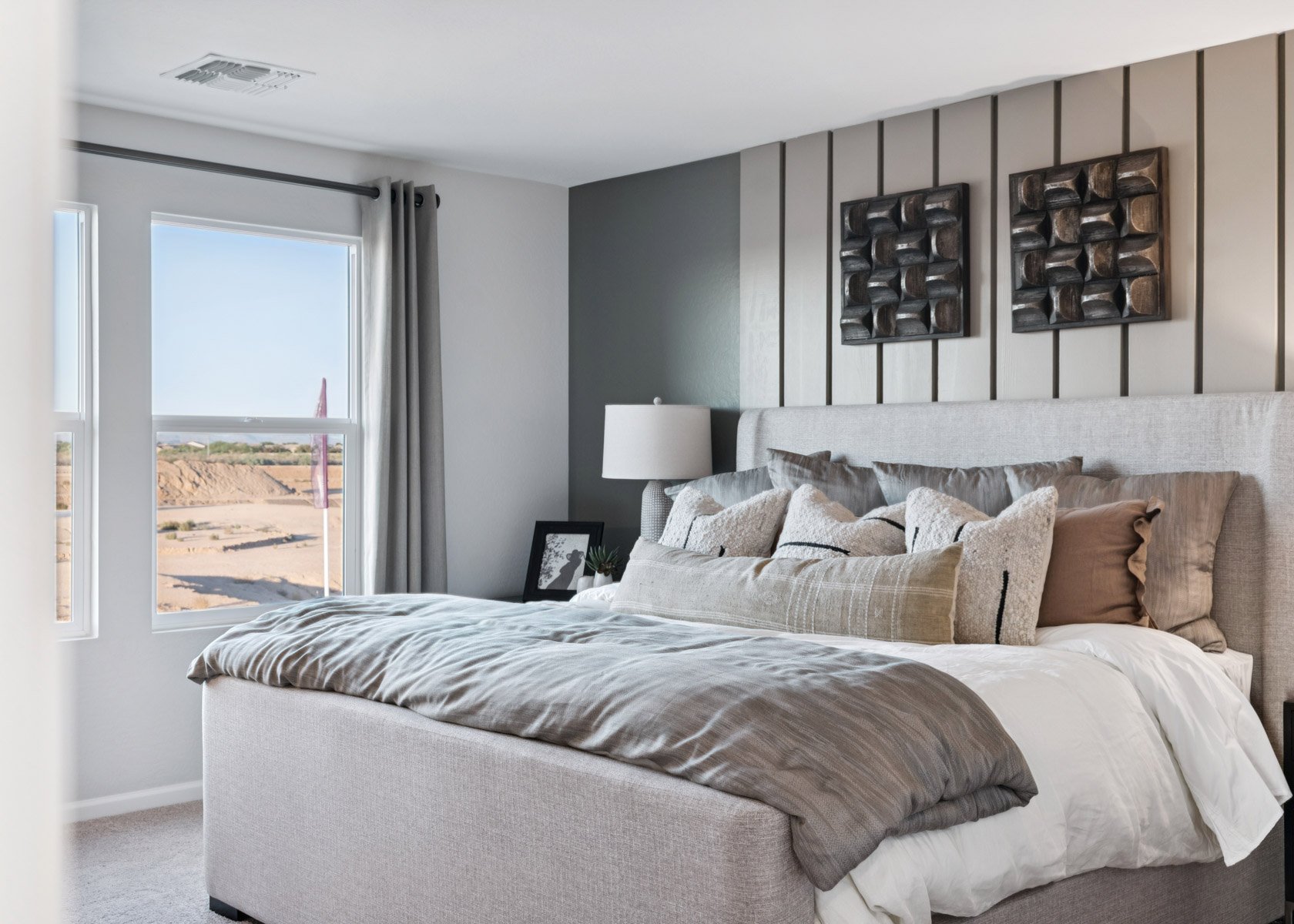 A bedroom with a large bed.