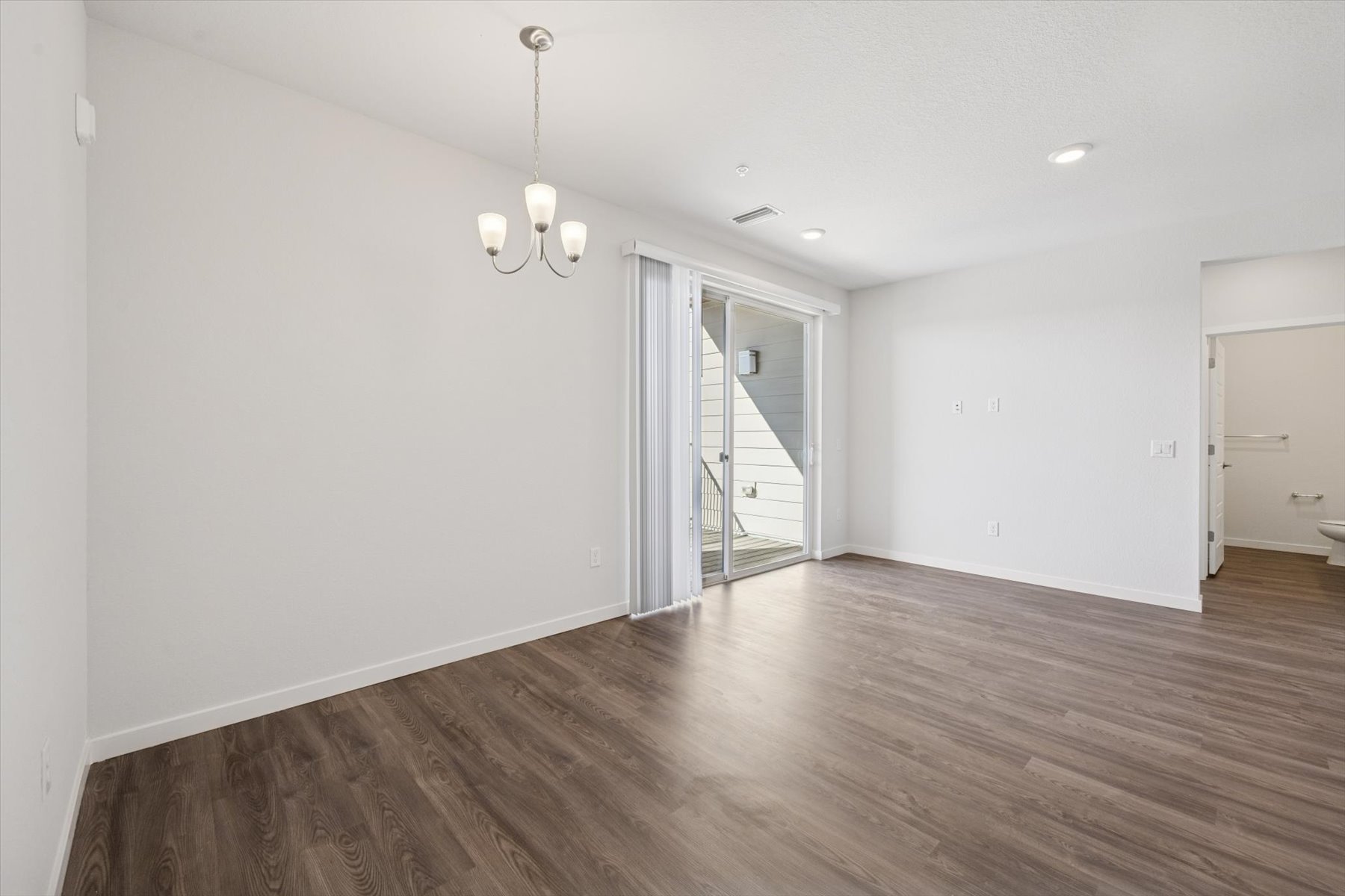 A room with a wood floor and a wood floor.