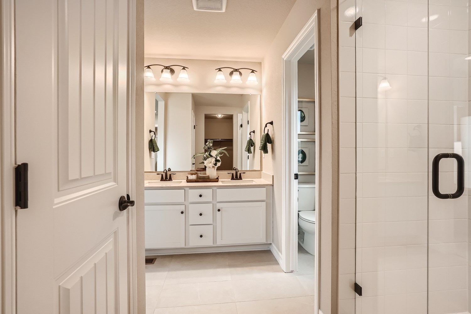 A bathroom with a shower and sink.