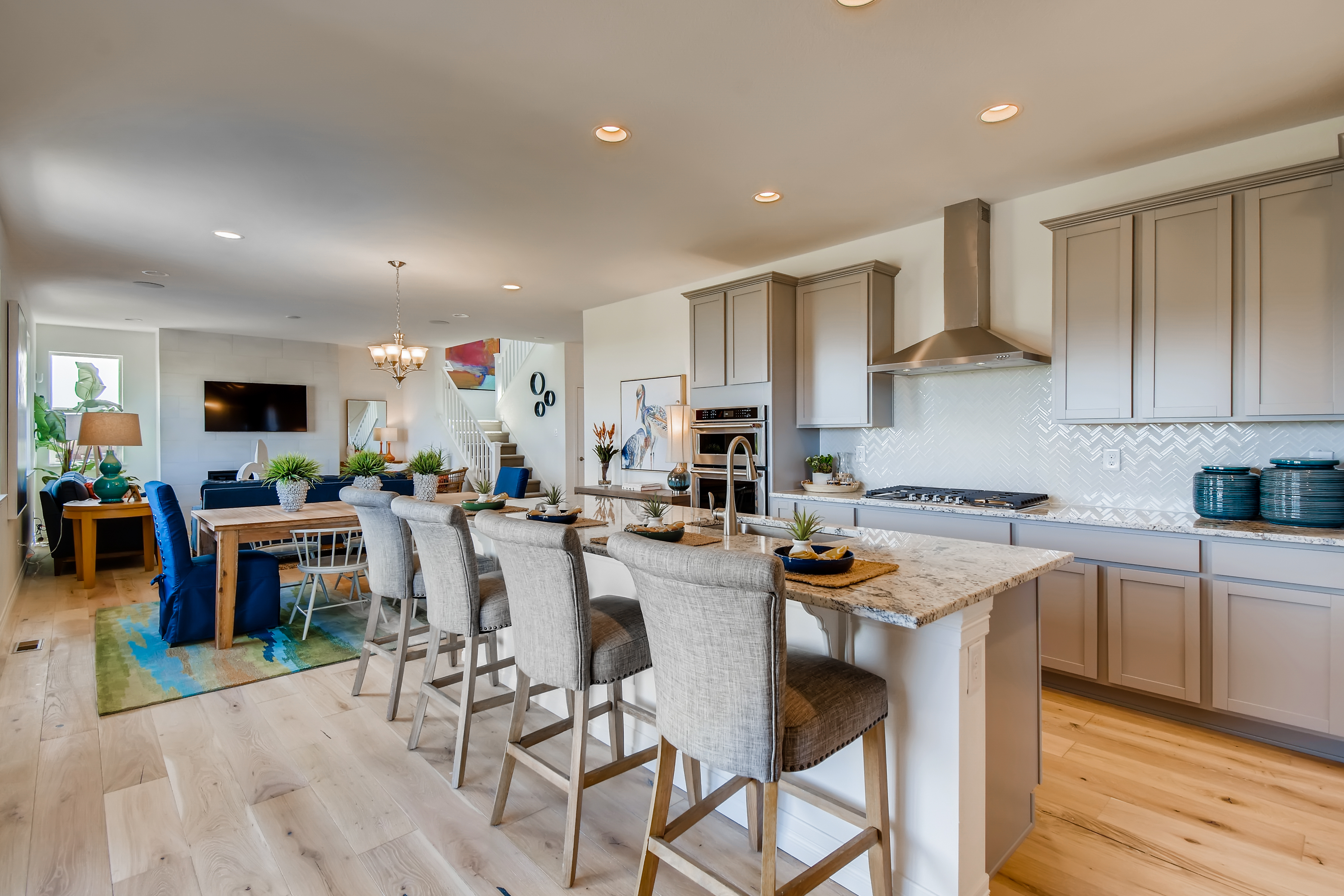 A kitchen with white cabinets.