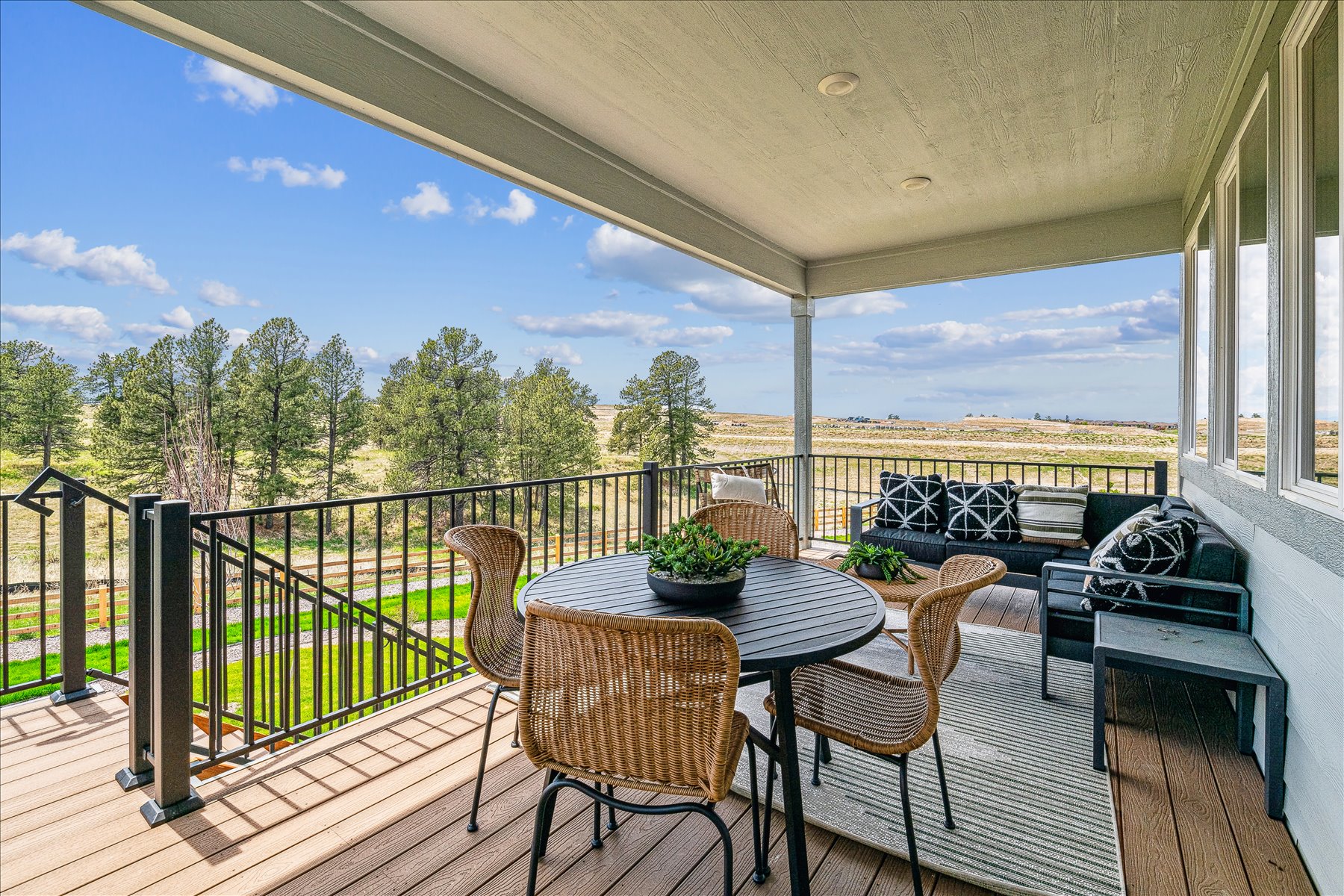 A patio with a table and chairs.