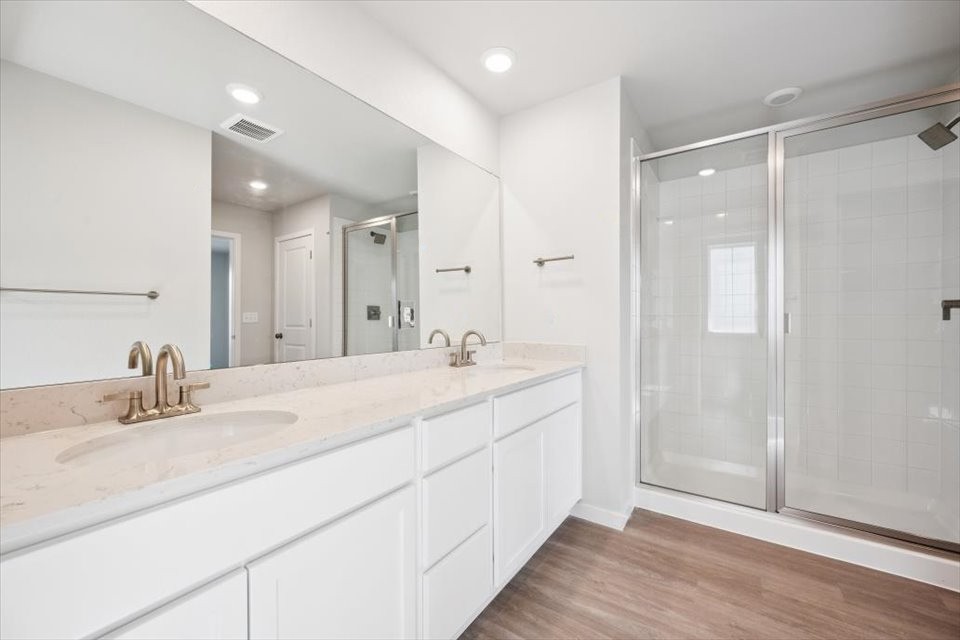 A bathroom with a large mirror.
