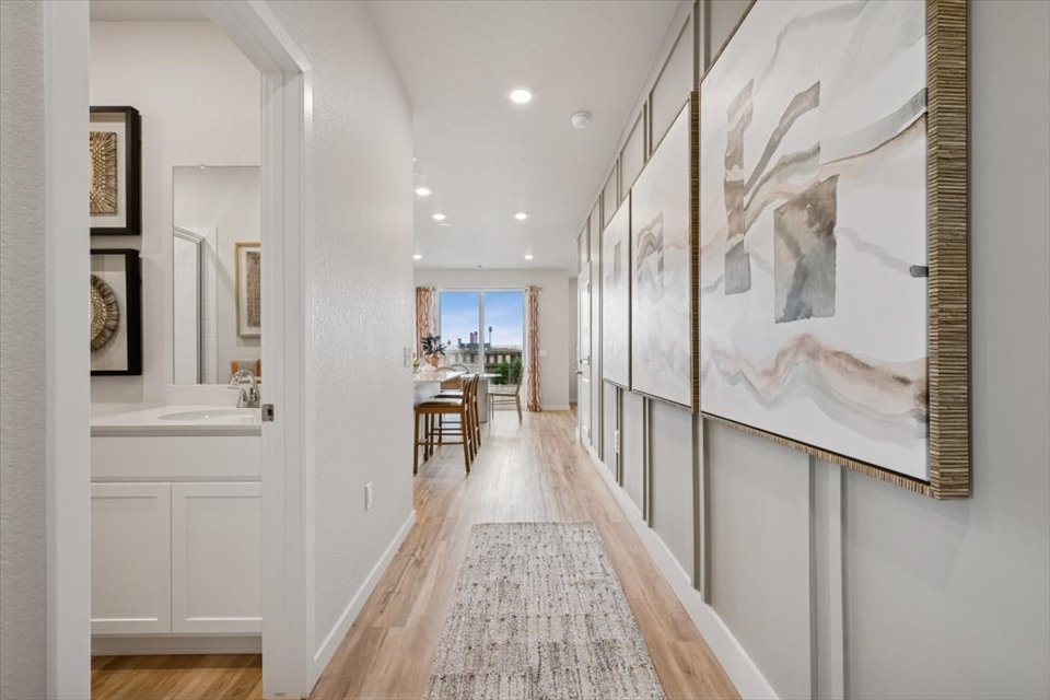 A bathroom with a sink and a mirror.
