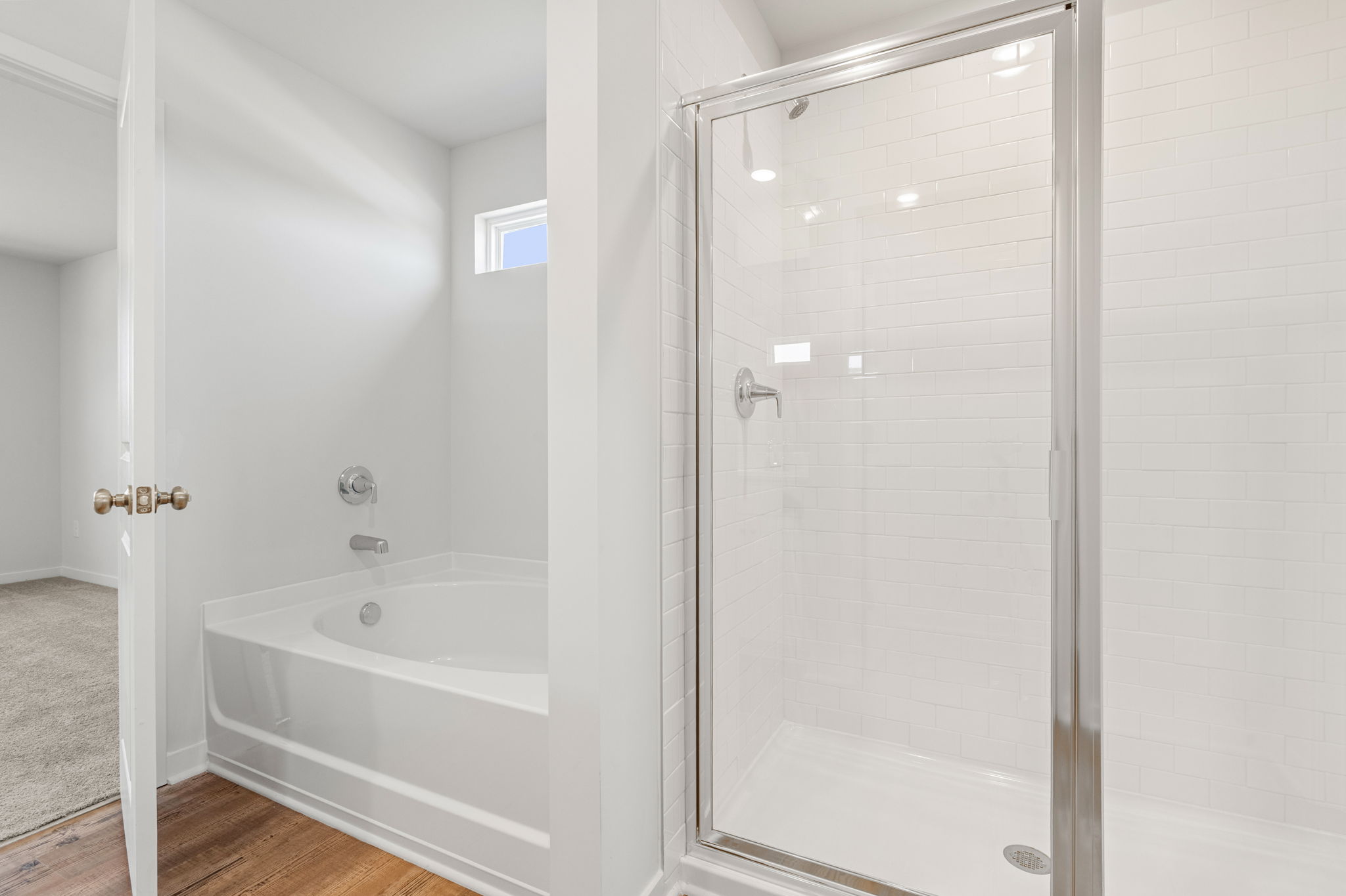 A bathroom with a glass shower.