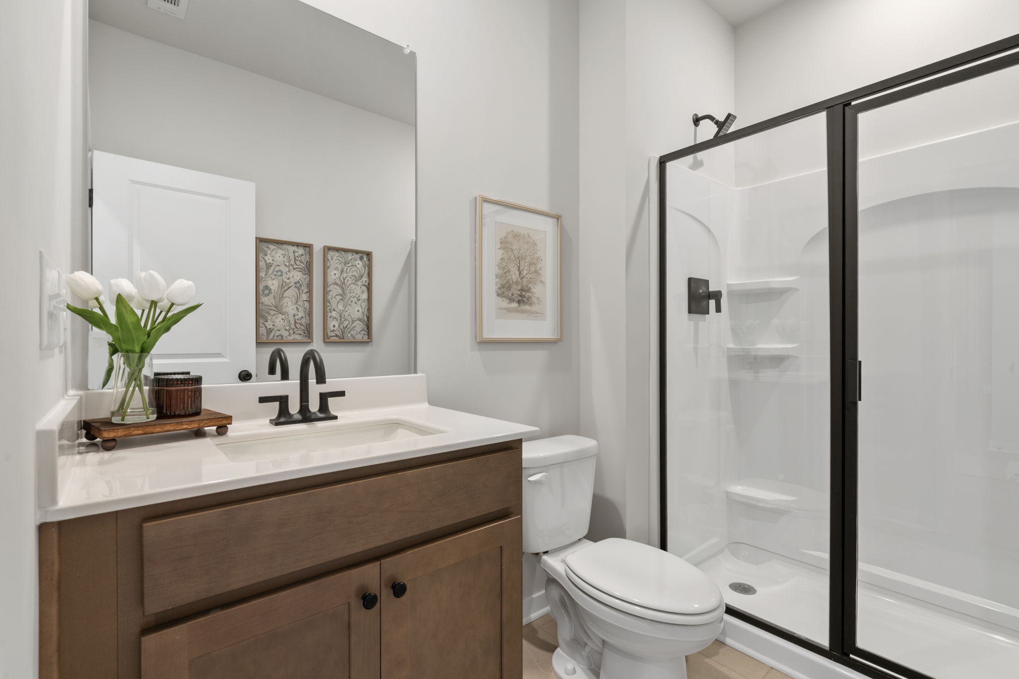 A bathroom with a glass shower.
