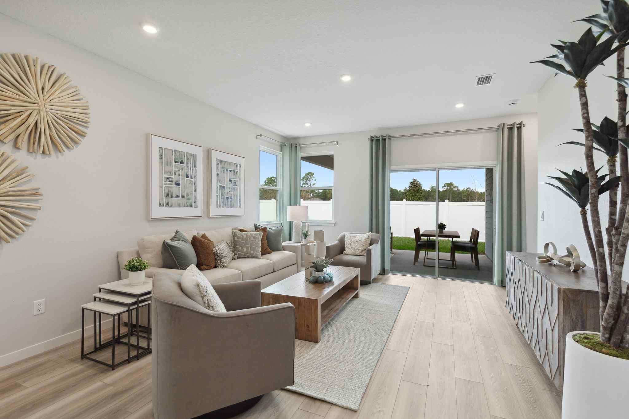 A living room with a large glass door.