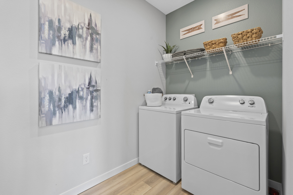 Coronado Model Home Laundry Room with Washer and Dryer at Reserve East in Flagler Beach