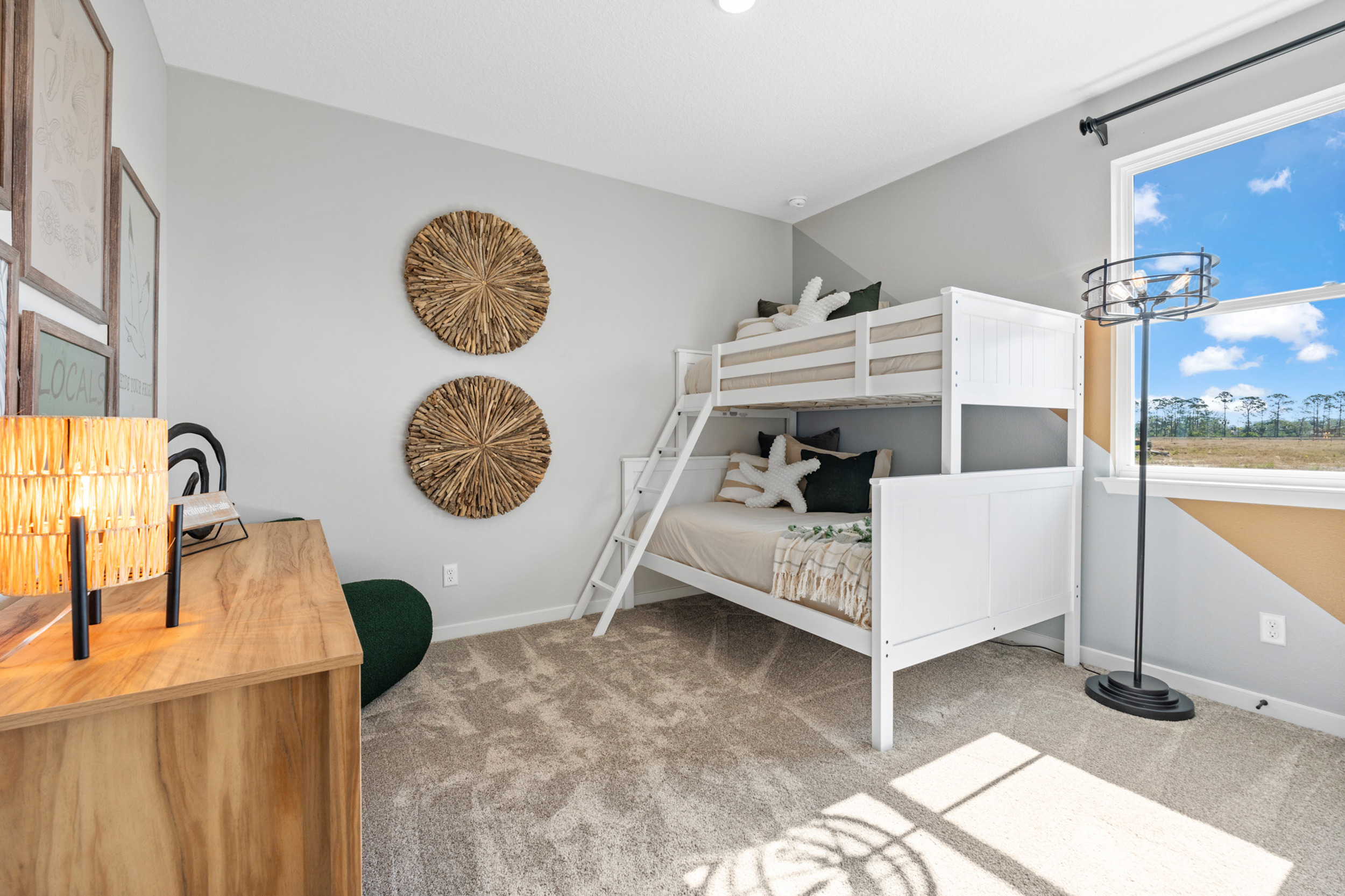 Kenai Model Home Guest Room with Bunk Beds and Desk at Reserve East in Flagler Beach