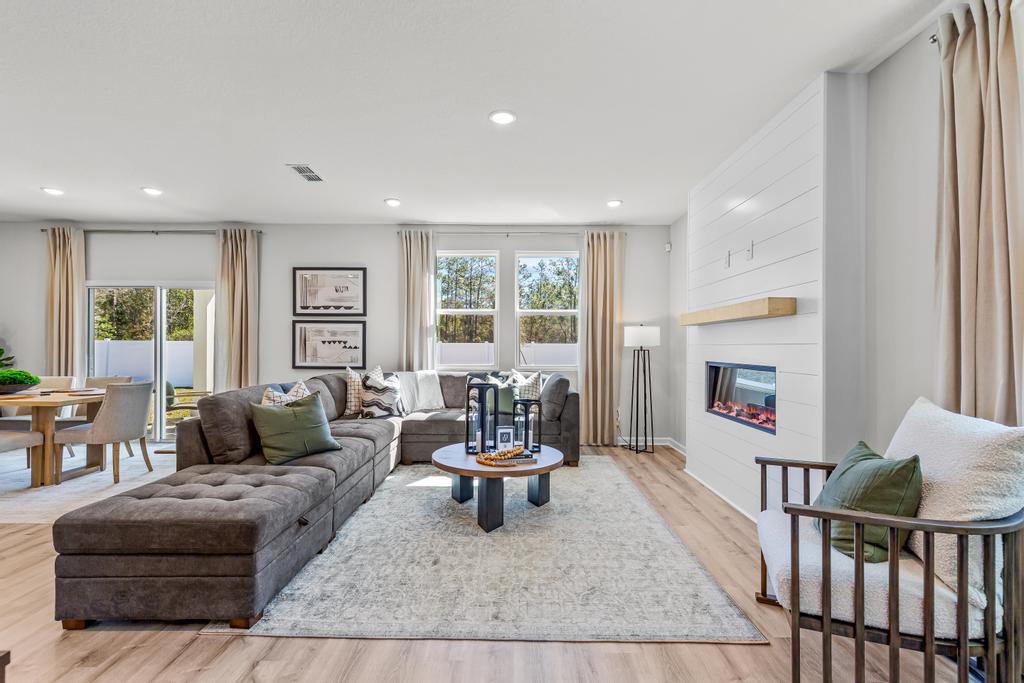 A living room with a couch and a table.