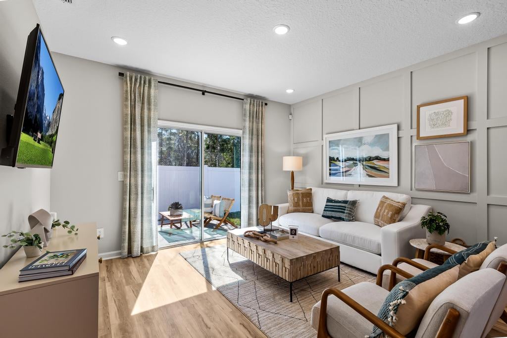 A living room with a tv and couches.