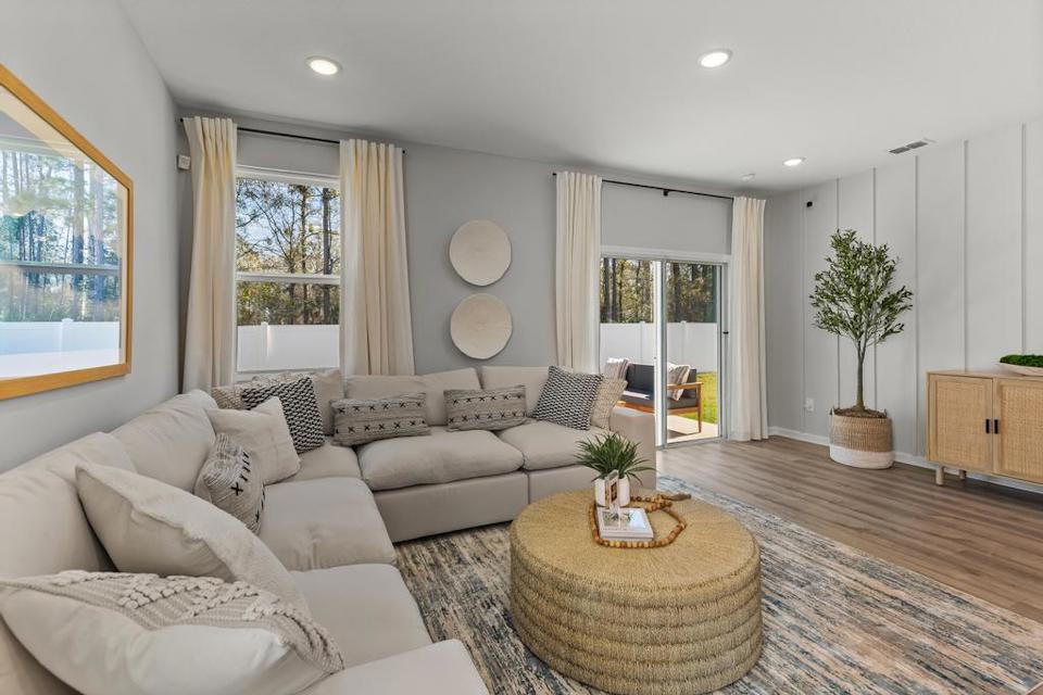 A living room with a large window.