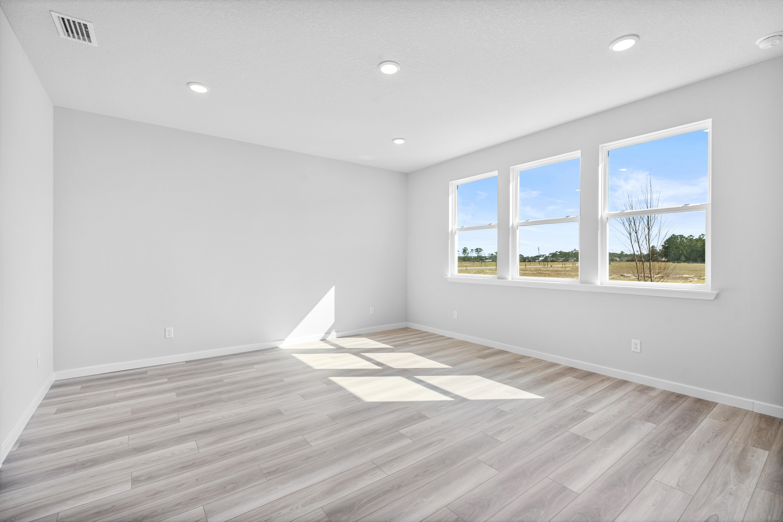 Lot 46 Primary Bedroom with LVP Floors at Reserve East