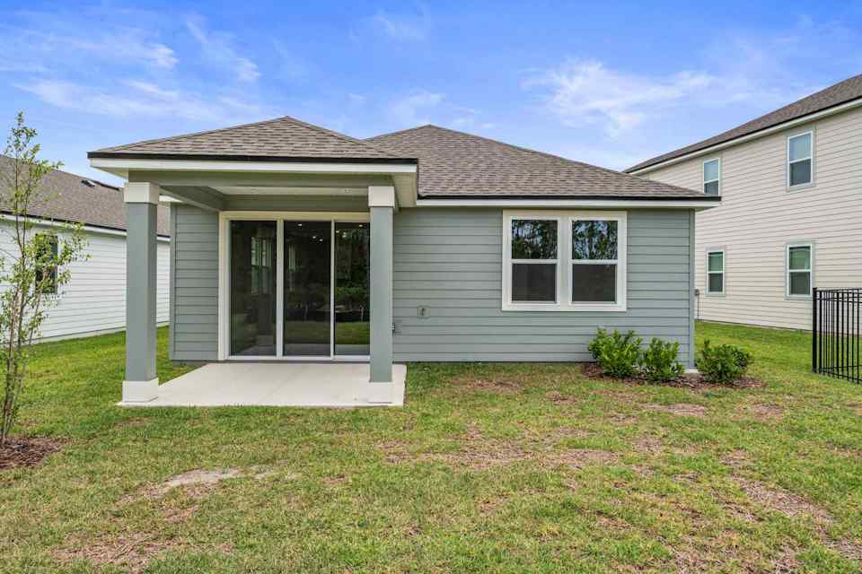 Sanibel II Floorplan Lot 72 Backyard with Covered Patio at Seminole Palms in Palm Coast