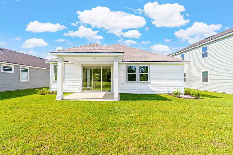 Charleston II Lot 54 Rear Exterior with Covered Patio at Seminole Palms in Palm Coast