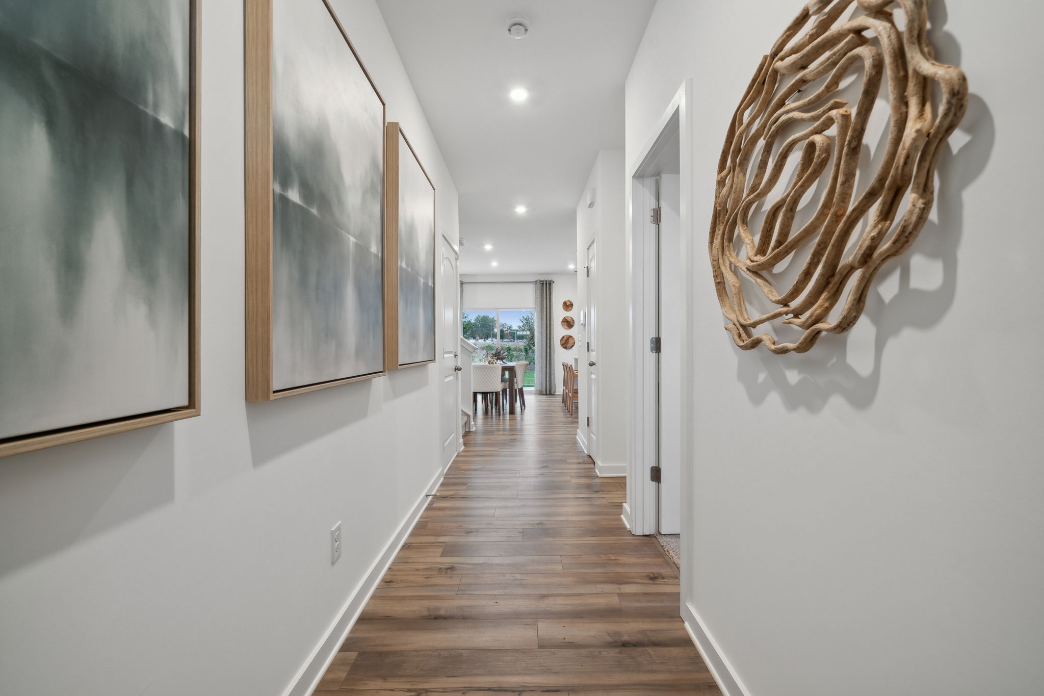 A hallway with white walls.