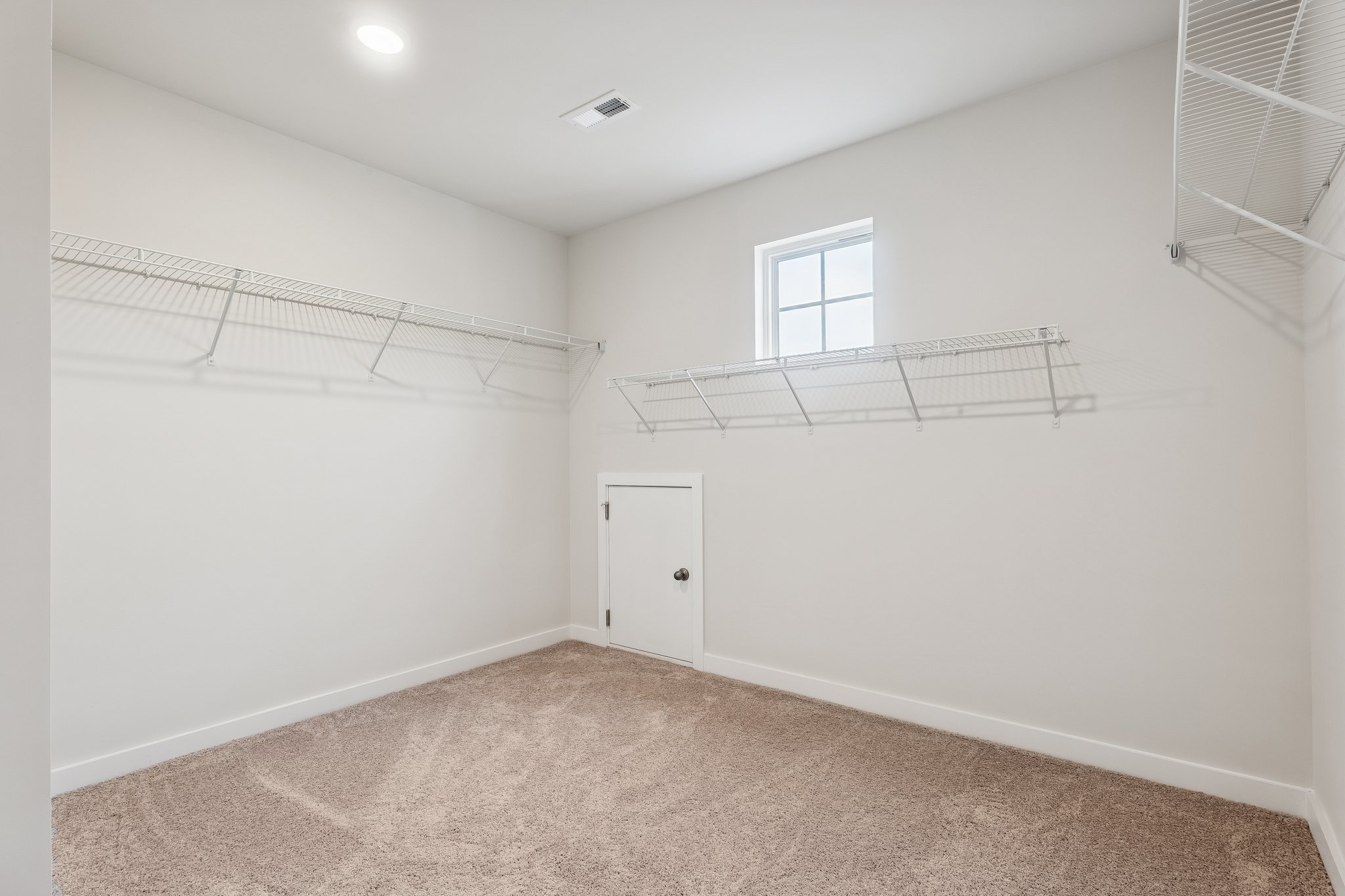 A room with a door and a window.
