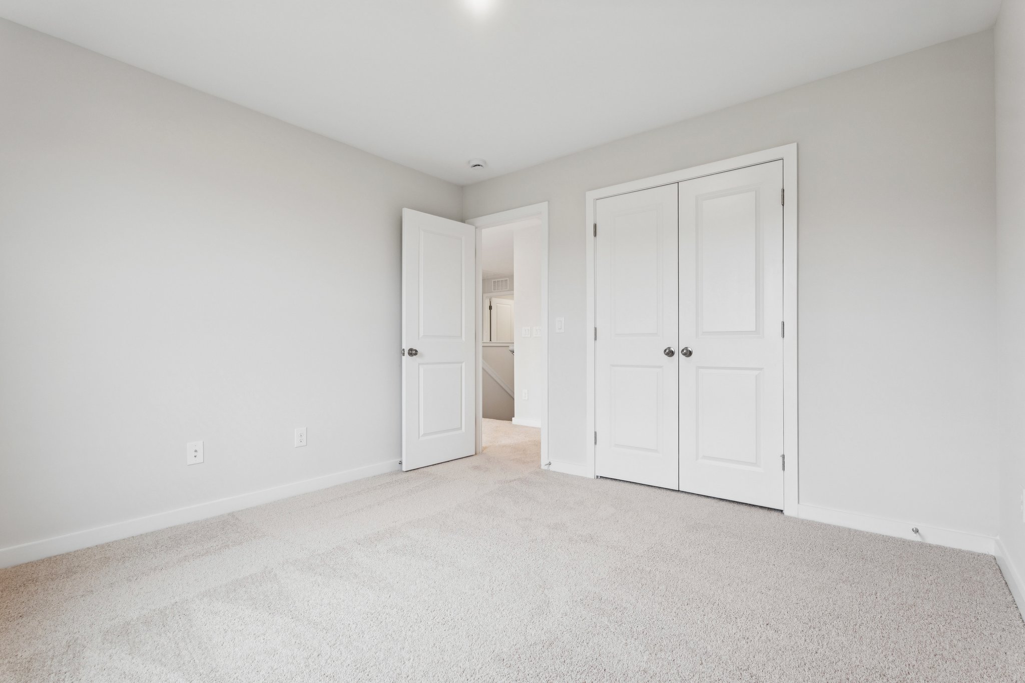 A room with white doors.