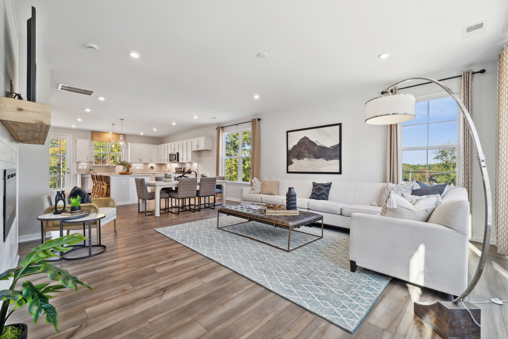 A living room with a wood floor.