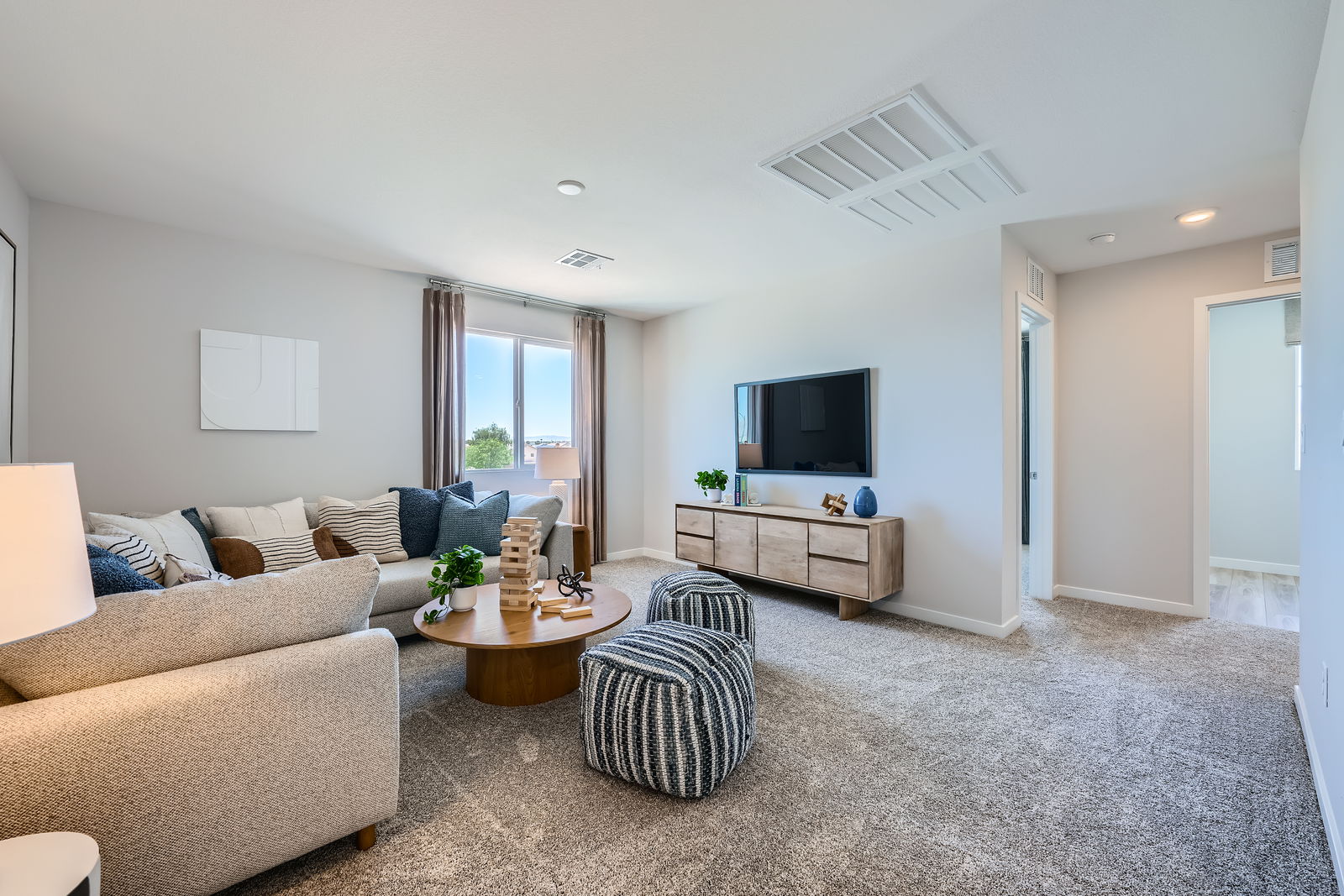 A living room with a tv and couches.