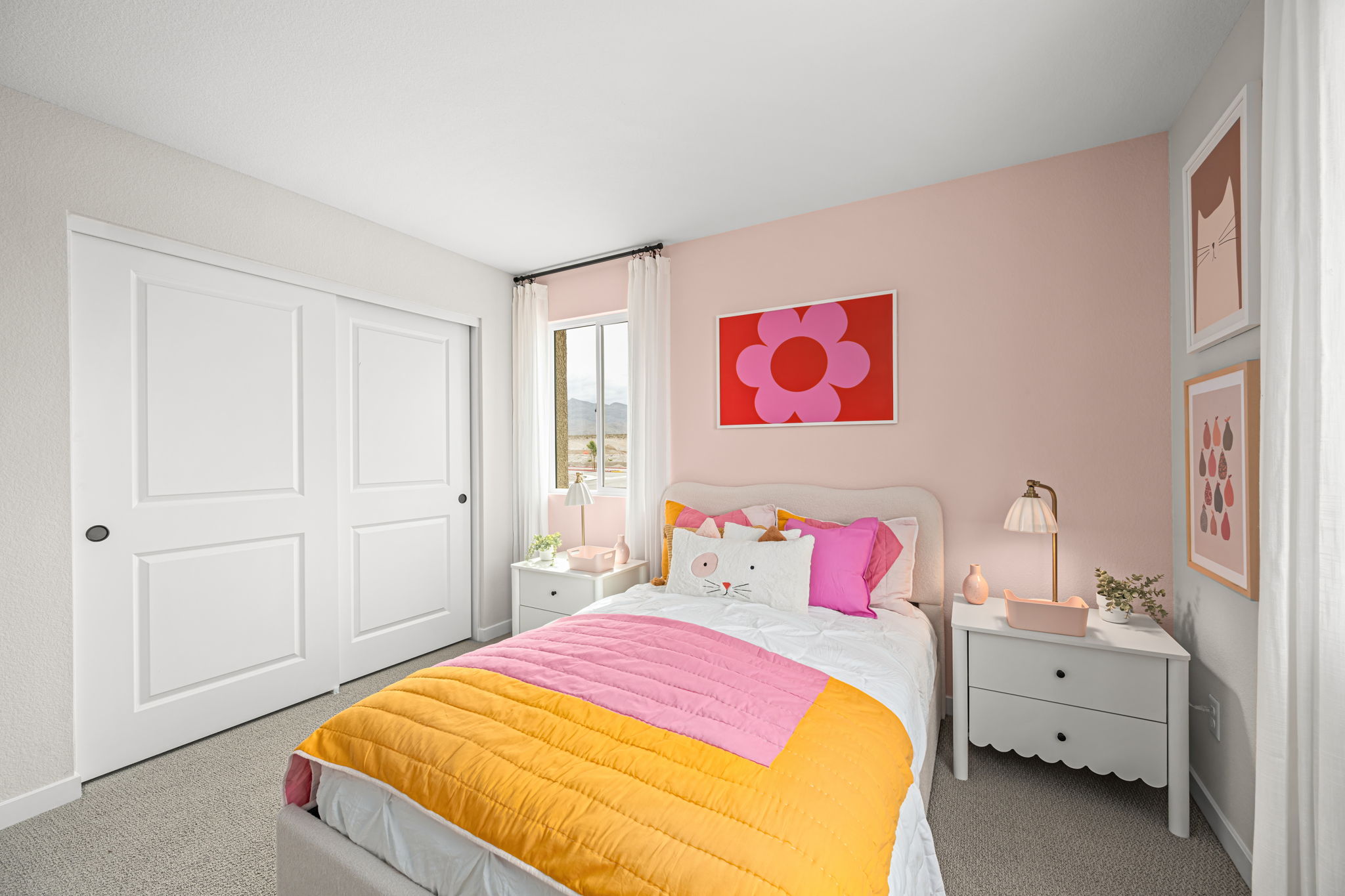 A bedroom with a bed and a dresser.