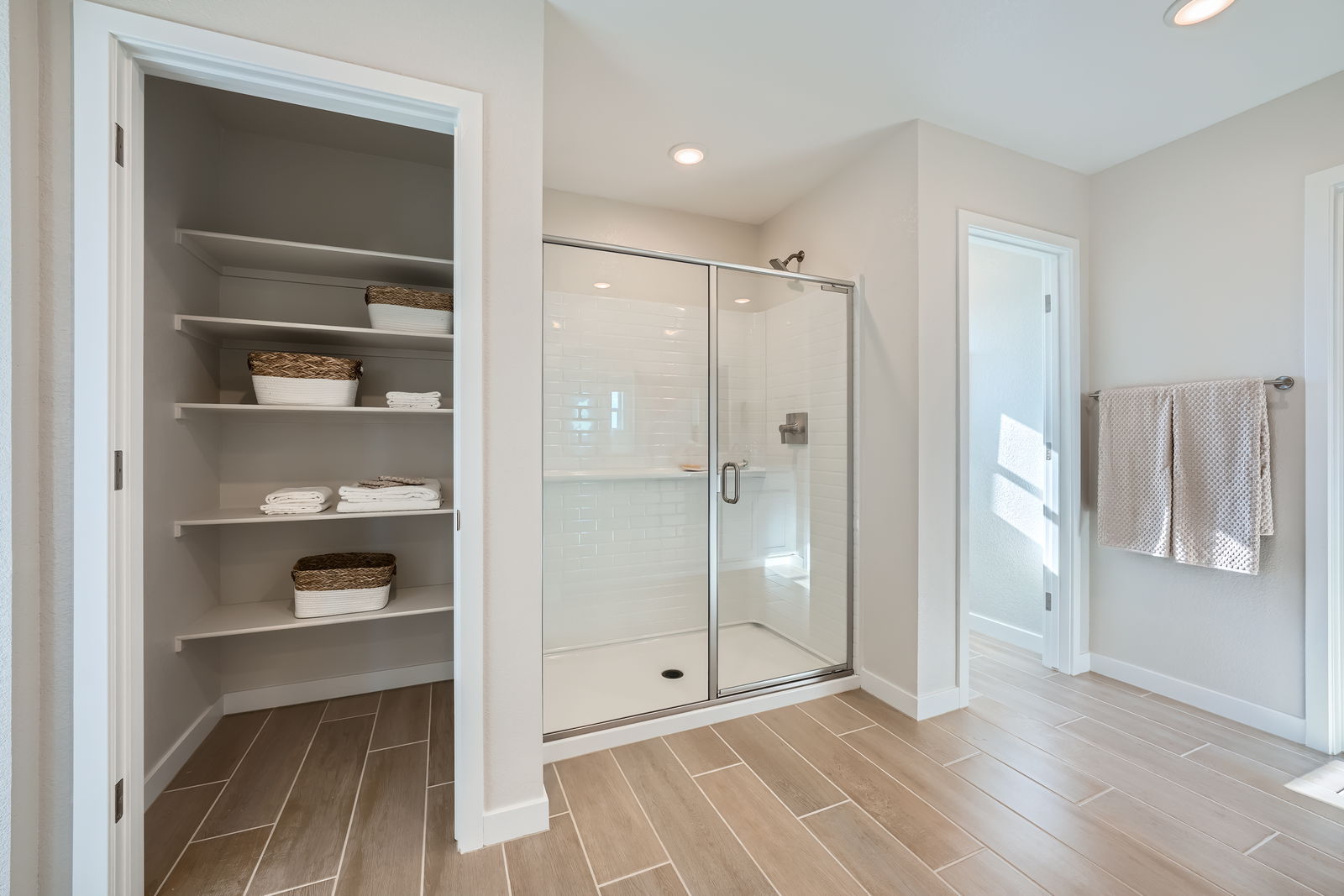 A room with a closet and a glass door.