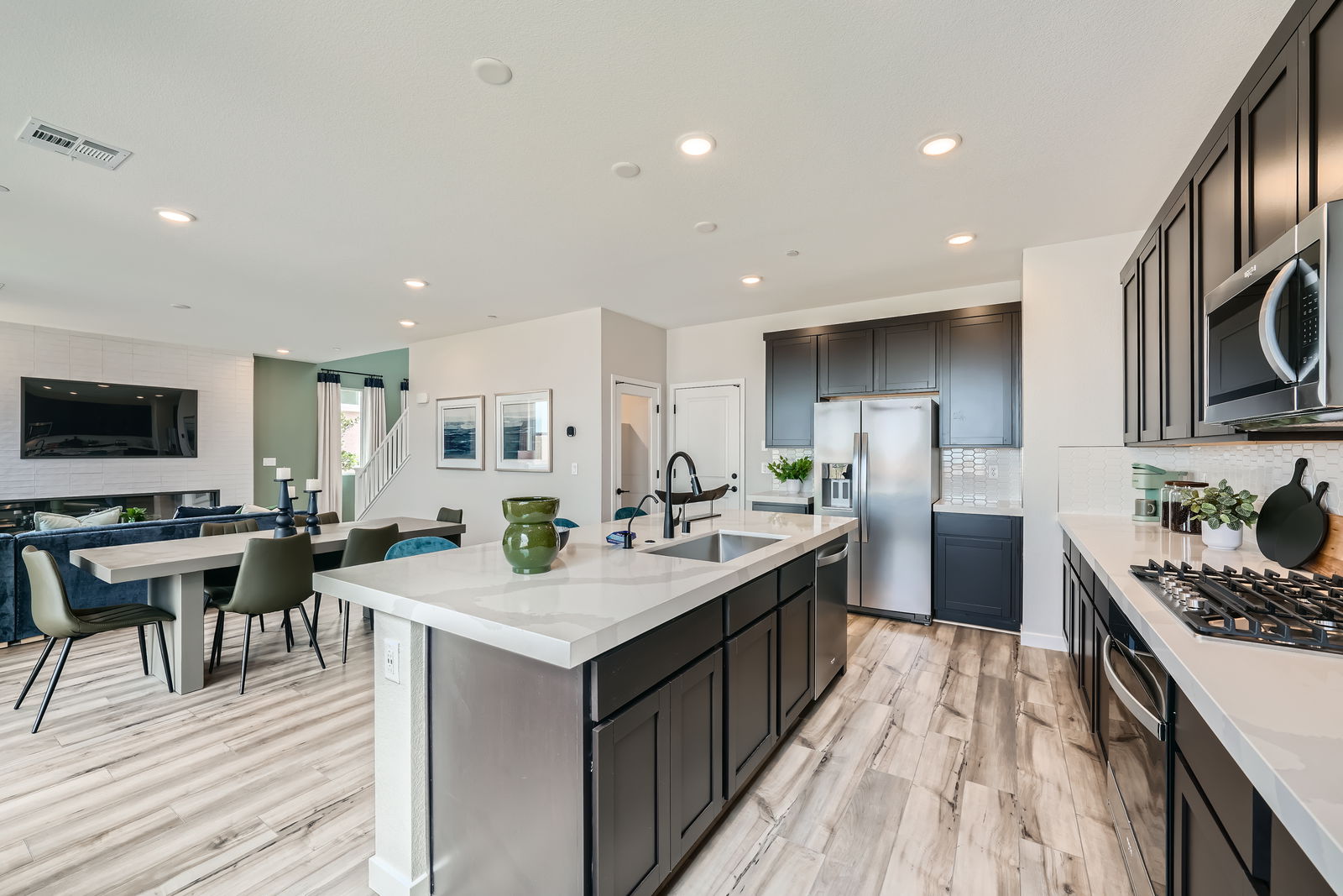 A kitchen with a wood floor.