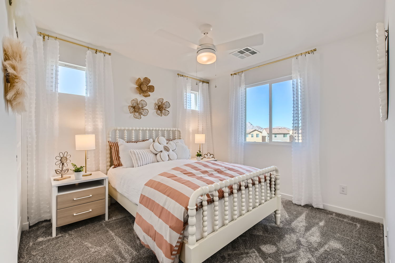 A bedroom with a bed and a window.