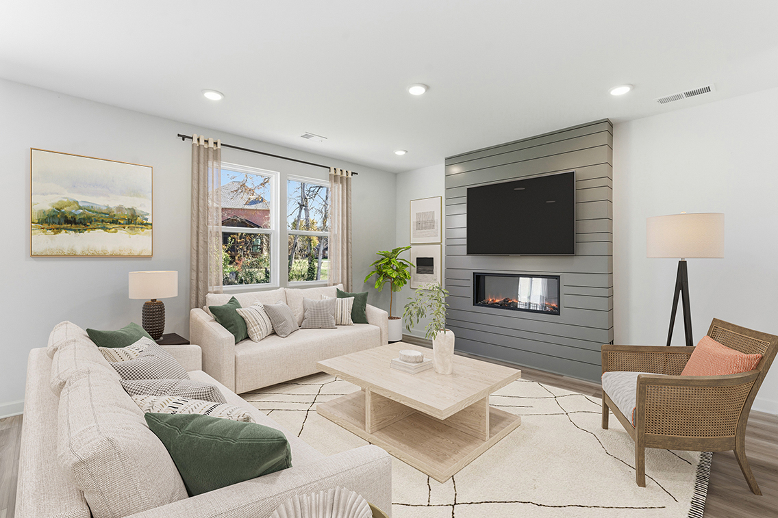 A living room with a fireplace.