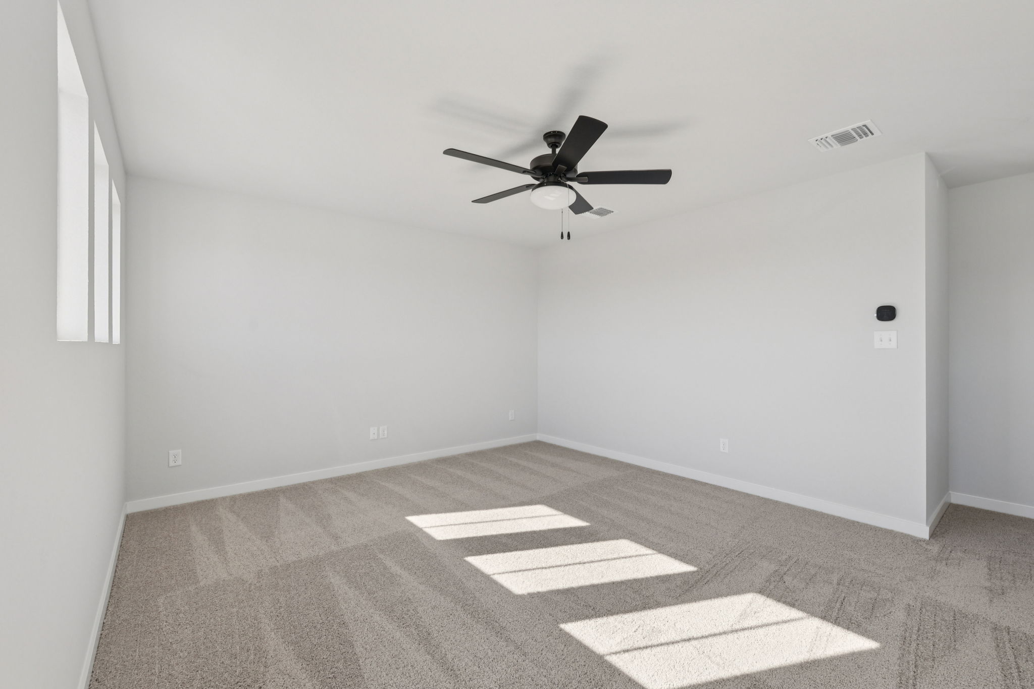 A ceiling fan in a room.