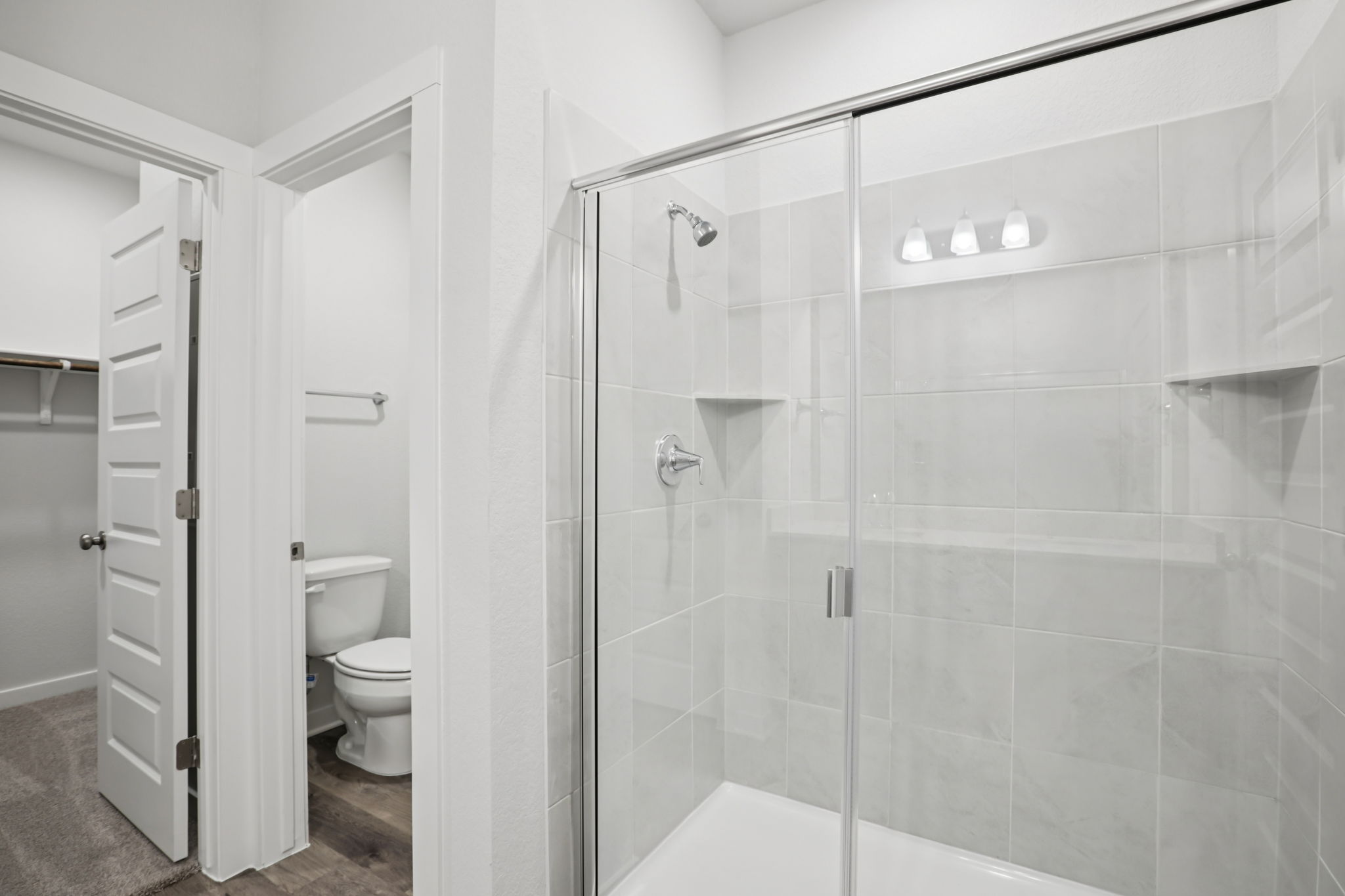 A bathroom with a glass shower.