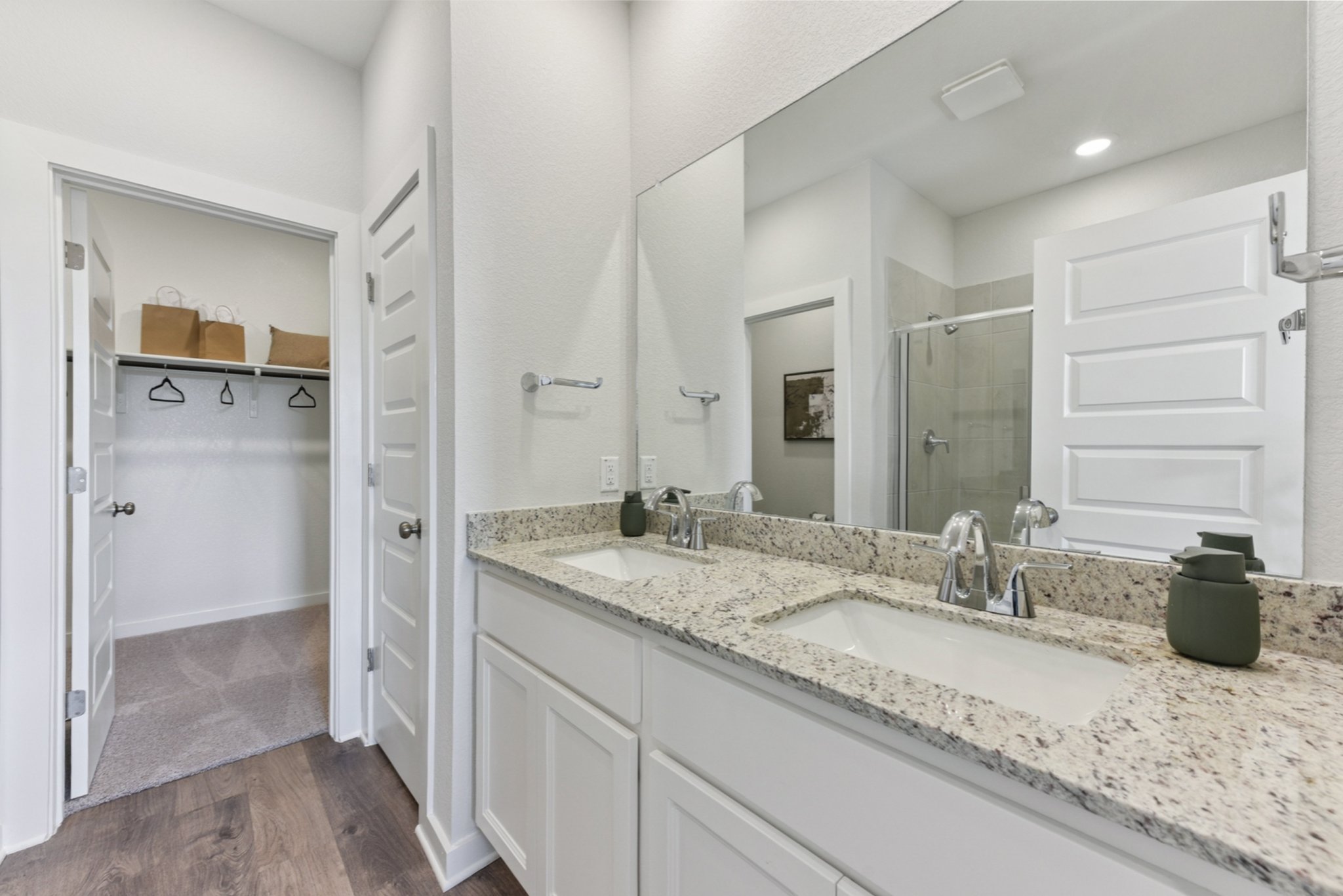 A bathroom with a marble countertop.