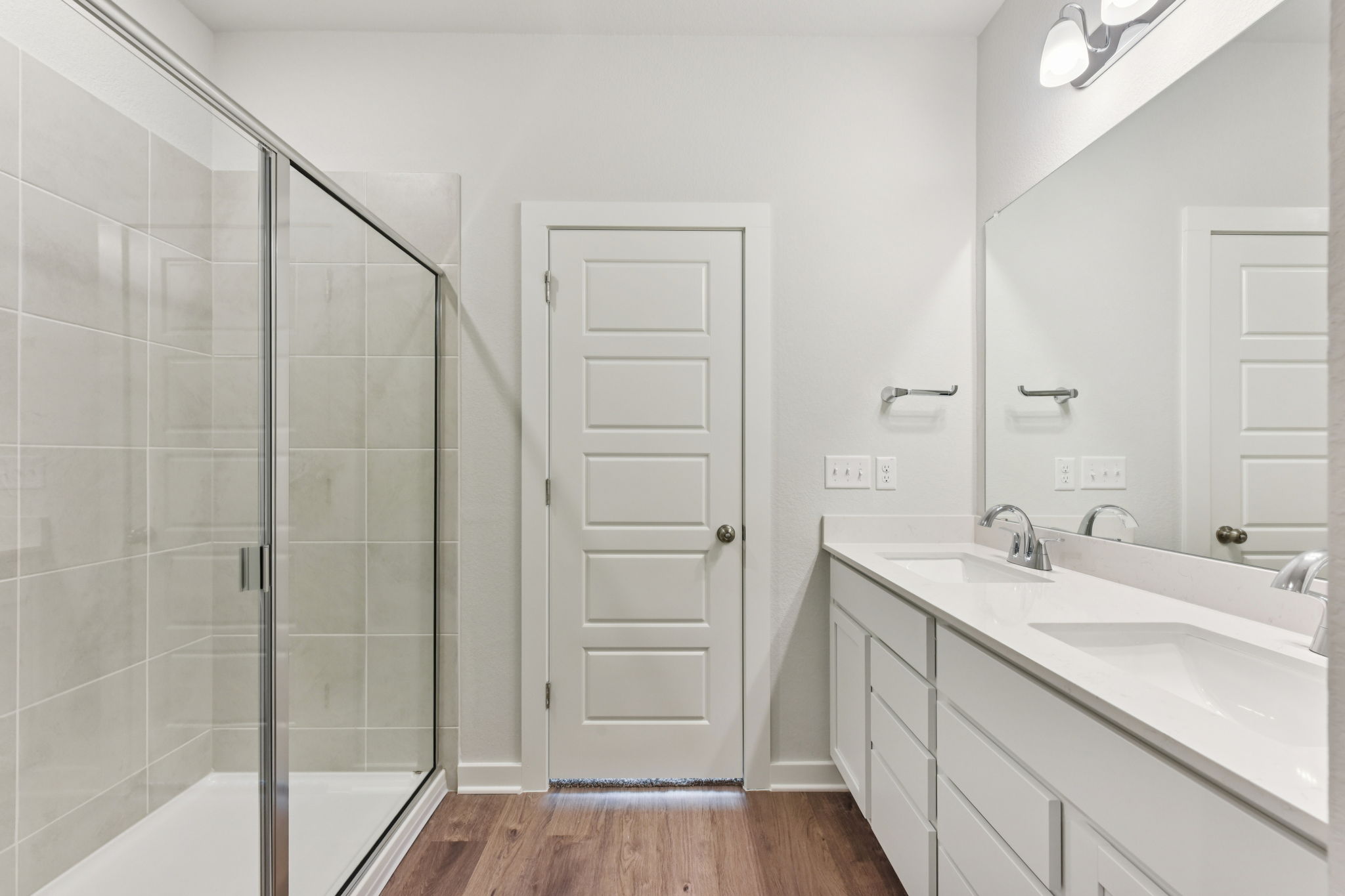 A bathroom with a glass shower.