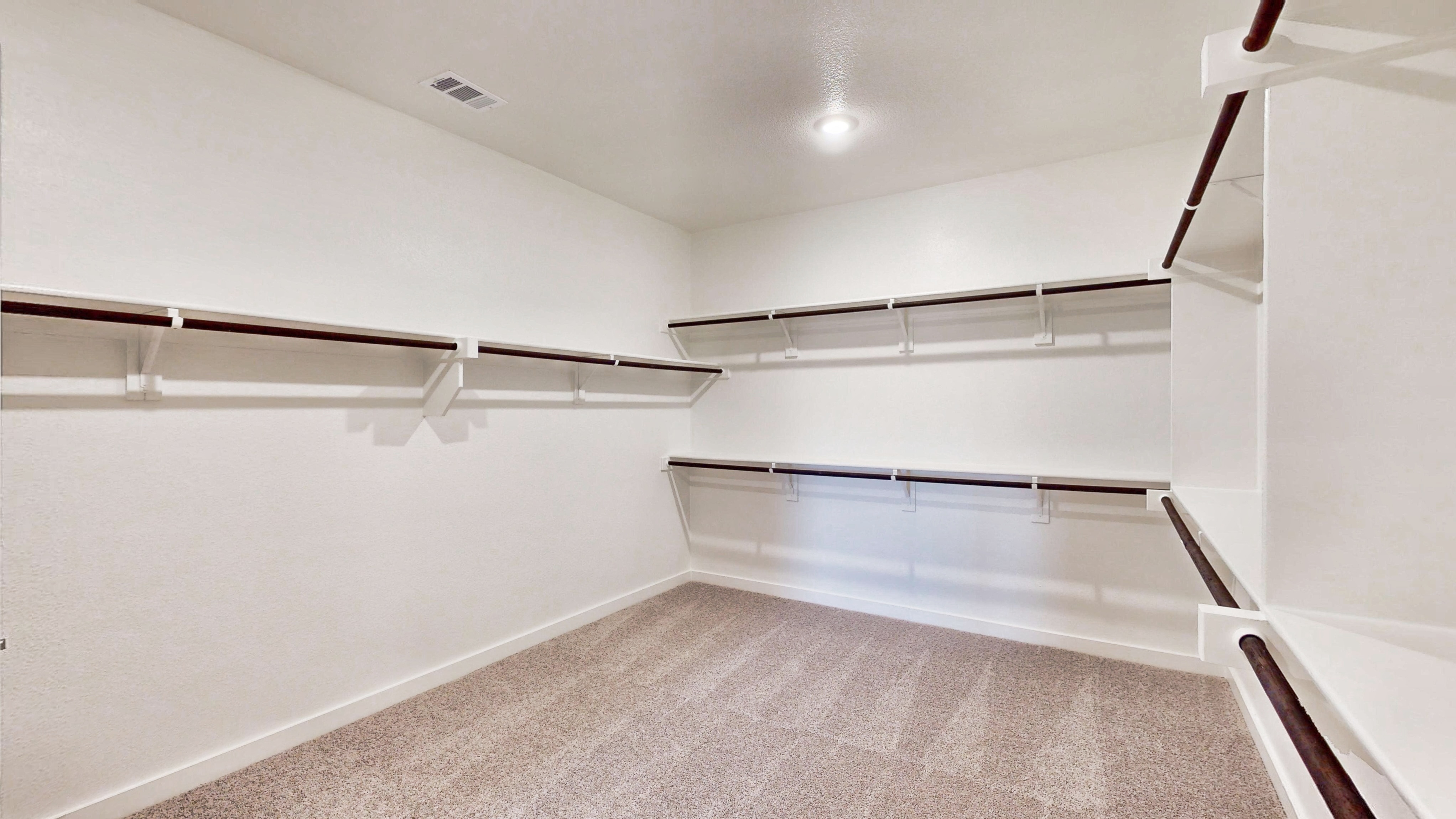 A white room with a staircase.