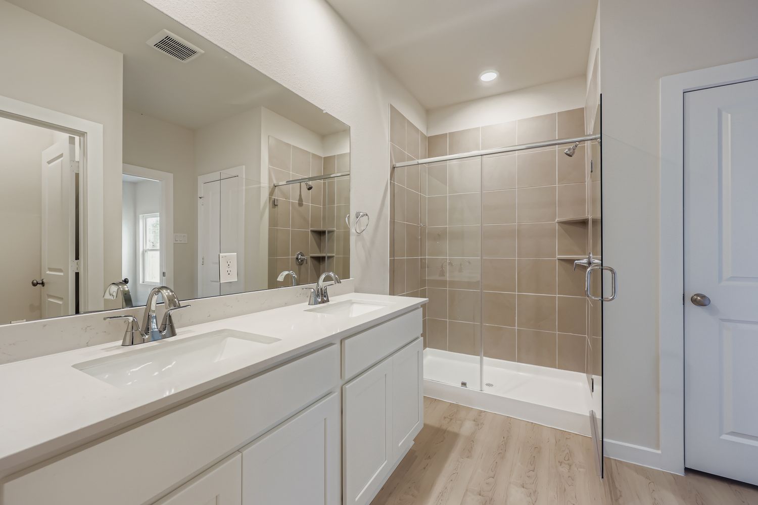 A bathroom with a glass shower.