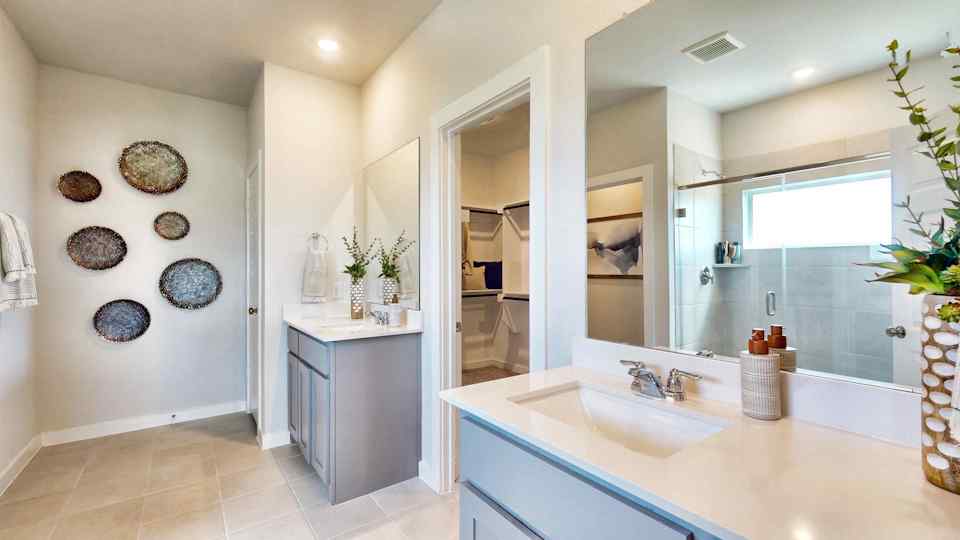A bathroom with a large mirror.