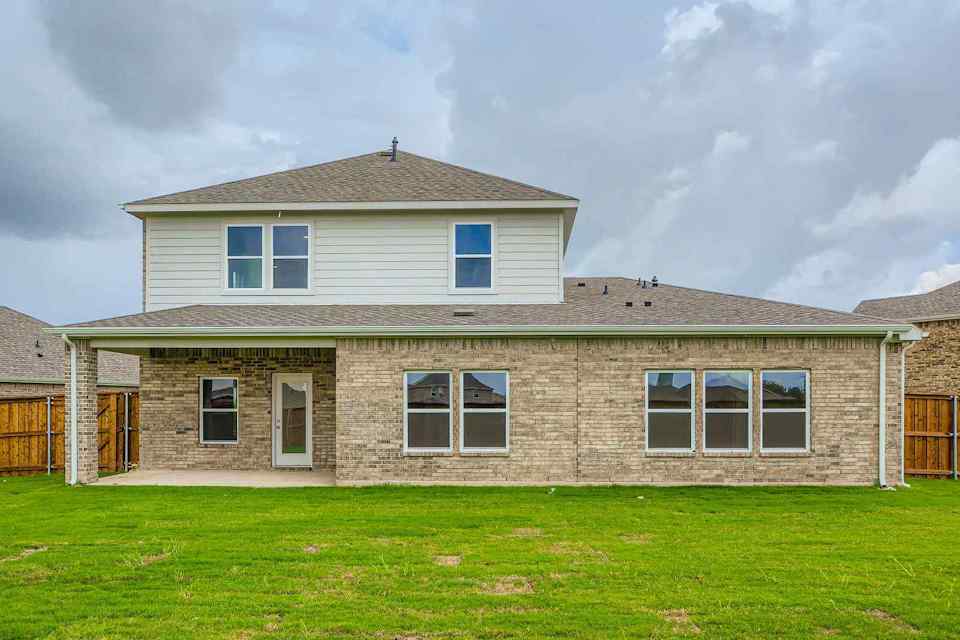 A house with a grass yard.