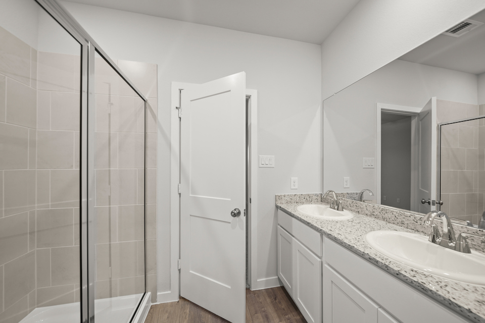 A bathroom with a glass shower.