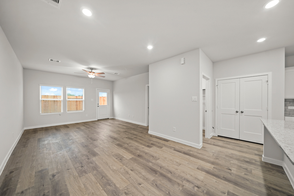 A room with white cabinets.